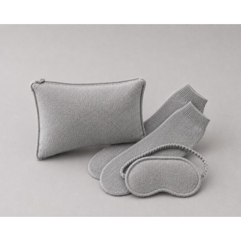 Travel in unparalleled comfort and style with this luxurious cashmere travel set. Luxury